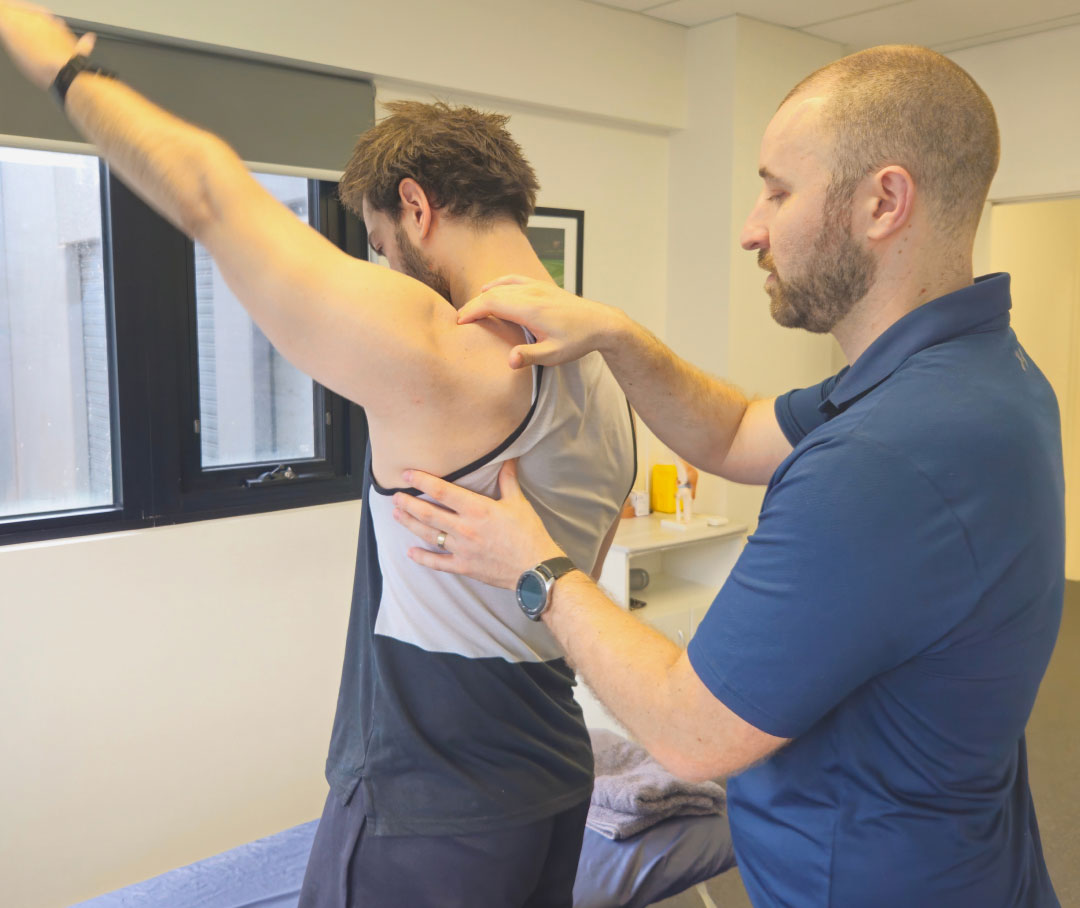 physio-examining shoulder-pain